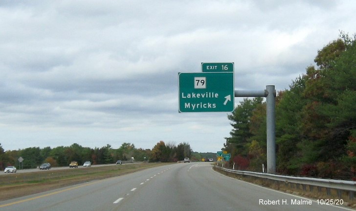 Image of overhead ramp sign and ground mounted gore sign for MA 79 exit with new milepost based exit numbers and yellow old exit number tab below gore sign on MA 140 North in Taunton, October 2020