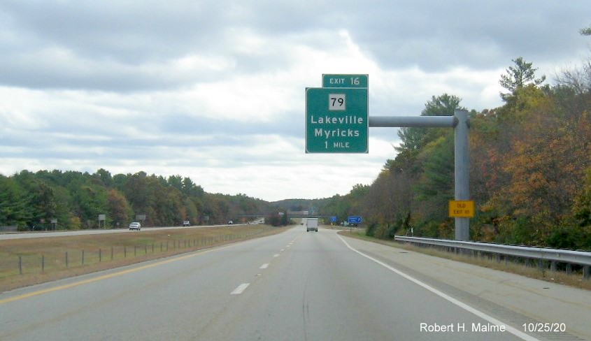 Image of 1-mile advance overhead sign for MA 79 exit now with new milepost based exit number and yellow old exit number tab on support post on MA 140 South in Taunton, October 2020