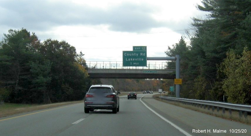 Image of 1-mile advance sign for the County Road exit with new milepost based exit number and yellow old exit tab on support post on MA 140 South in Lakeville, October 2020