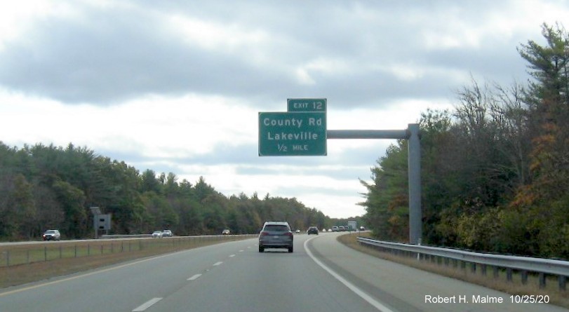 Image of 1/2 mile advance overhead sign for County Road exit with new milepost based exit number on MA 140 South in Lakeville, October 2020