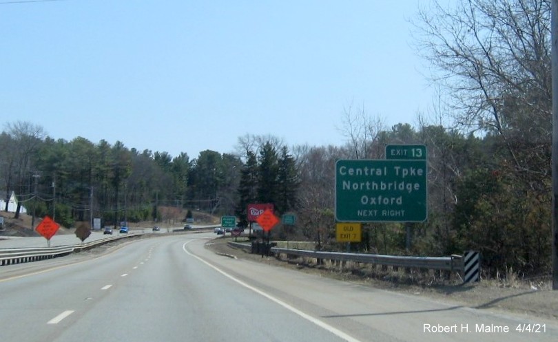 Image of advance sign for Central Turnpike exit with new milepost based exit number and yellow Old Exit 7 sign on left support on MA 146 South in Northbridge, April 2021