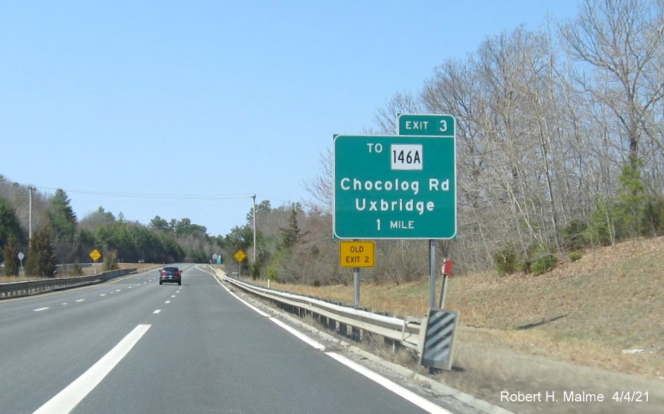 Image of 1 mile advance sign for To MA 146A exit with new milepost based exit number and yellow Old Exit 2 advisory sign on left support on MA 146 North in Uxbridge, April 2021