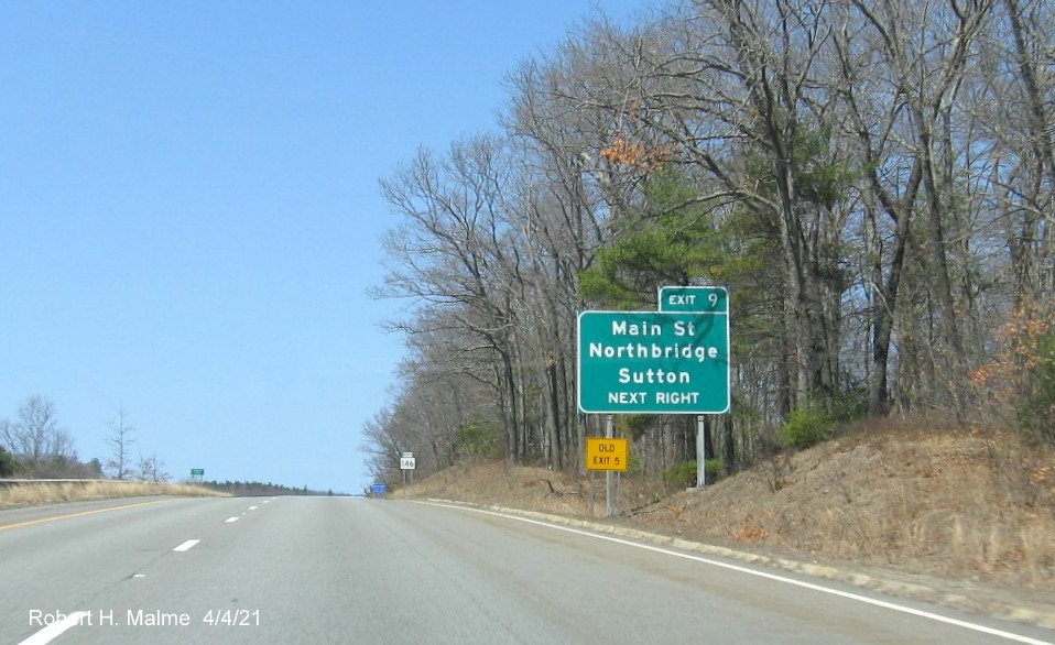 Image of advance sign for Main Street exit with new milepost based exit number and yellow Old Exit 5 sign on left support on MA 146 North in Northbridge, April 2021