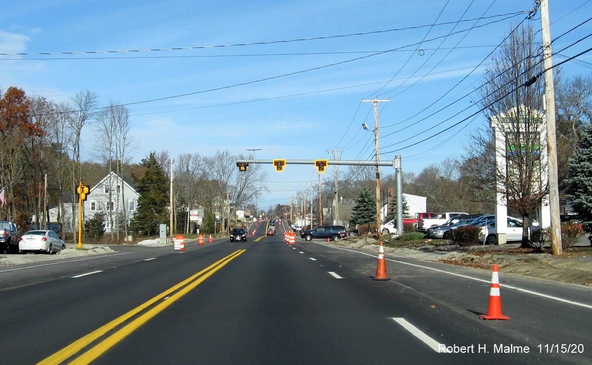 Image of overhead traffic signals at Abington Fire House over completed, but not opened four lanes of MA 18, November 2020