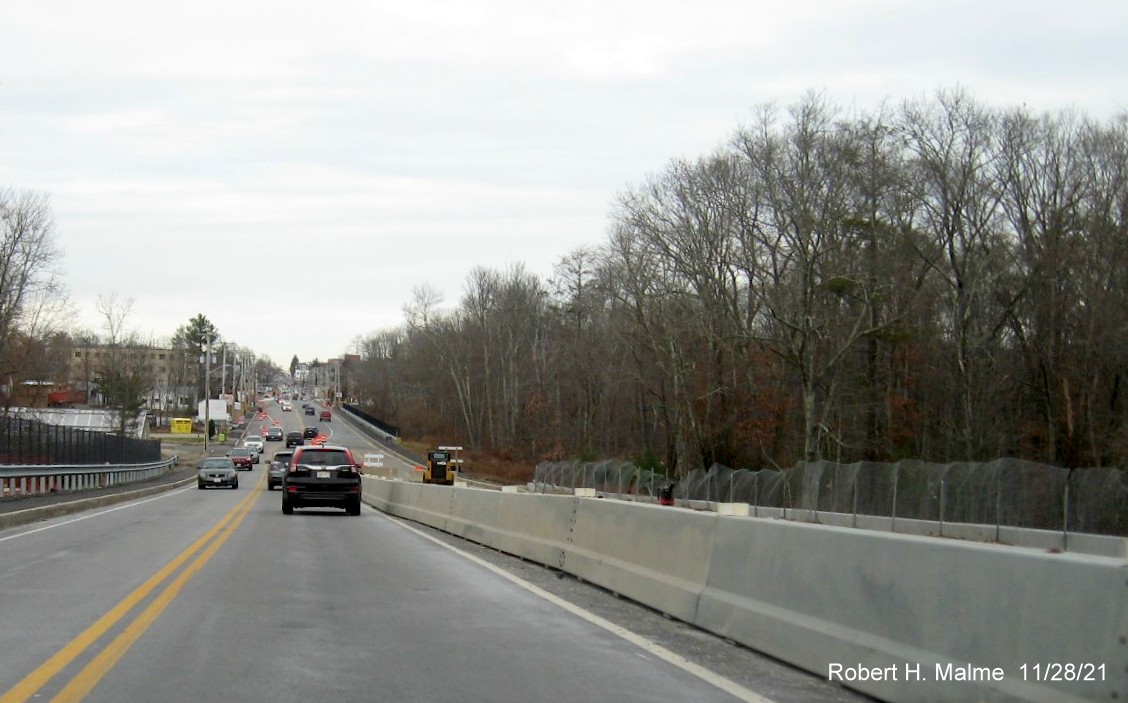 Image of view looking north along MA 18 toward Columbian Square in Weymouth from still incomplete railroad bridge, November 2021