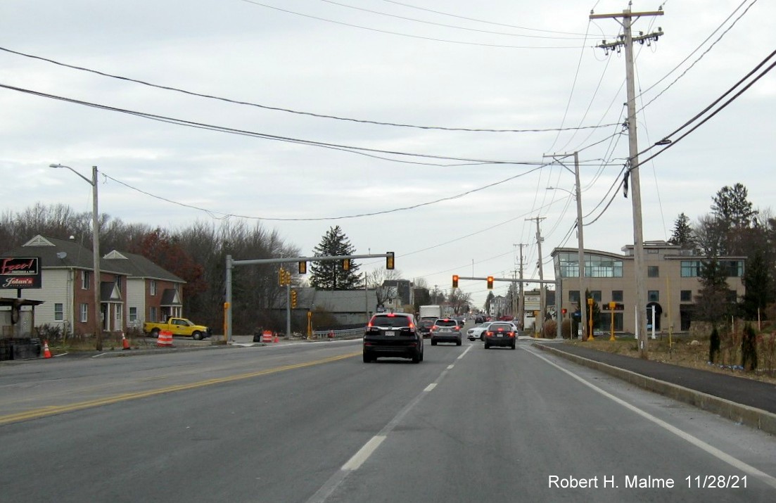 Image of view looking north along MA 18 at Union Point entrance in Weymouth with completed 2 lanes of traffic, November 2021