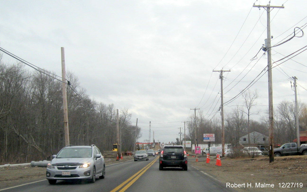 Image of utuly poles moved out of way along path of future right lane of MA 18 South in South Weymouth in Dec. 2019