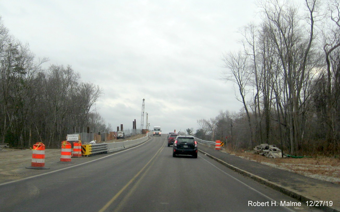 Image of widening work continuing for future MA 18 North lane on commuter railroad bridge in South Weymouth in Dec. 2019