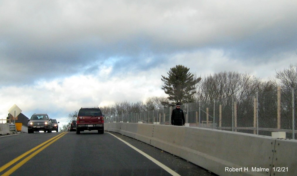 Image of new sidewalk intalled along MA 18 northbound in South Weymouth over the incomplete commuter
                                      railroad bridge, January 2021