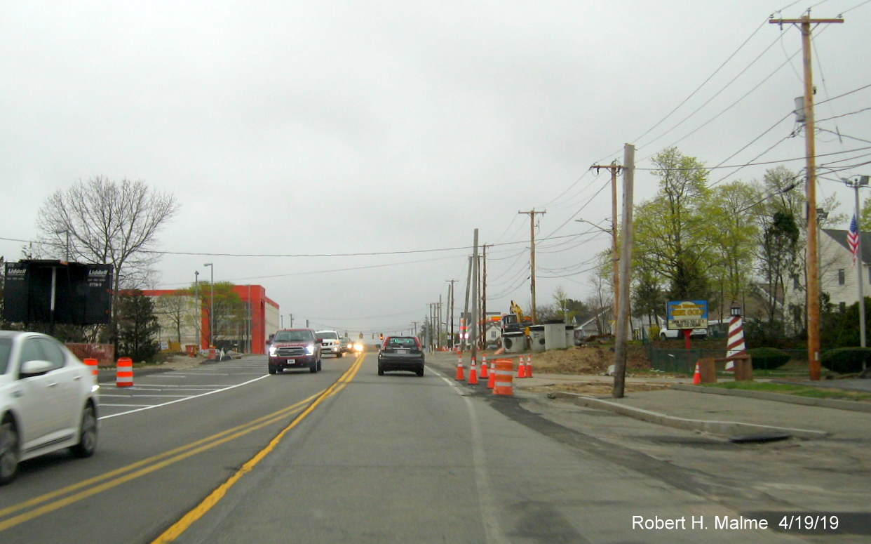 View of construction in MA 18 Widening Project work zone by commuter rail station in South Weymouth