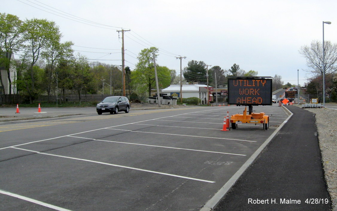 Image of completed MA 18 North lane with stripes to prevent use at the South Weymouth Commuter Rail Station parking lot