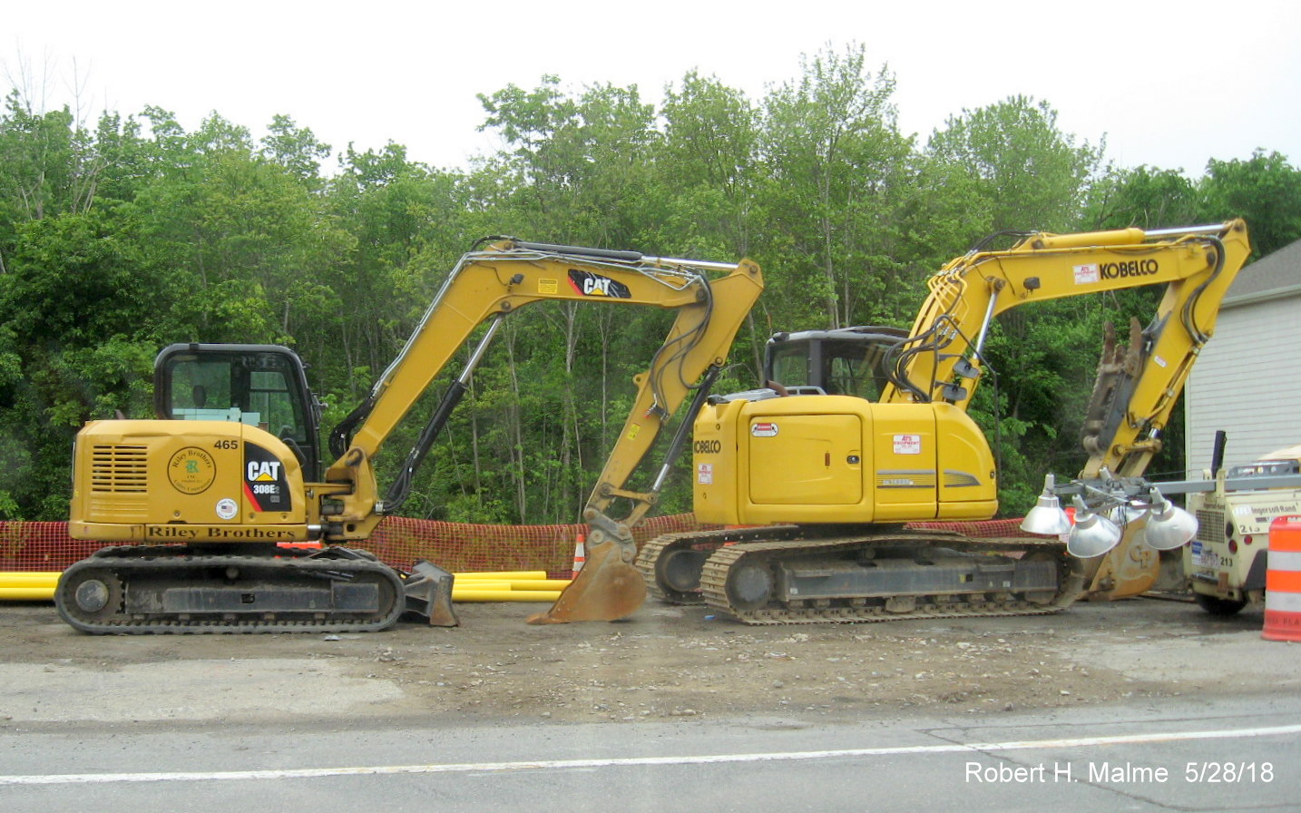 Image of construction equipment for widening project stored along MA 18 South in Weymouth