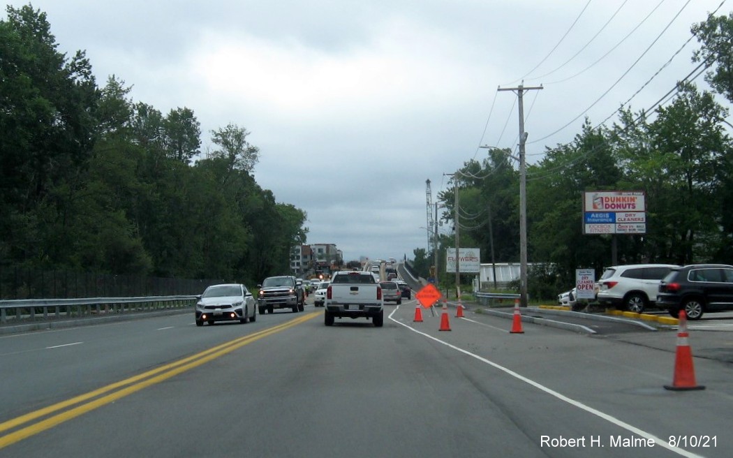 Image of traffic on MA 18 South approaching commuter railroad bridge still under construction in South Weymouth, August 2021