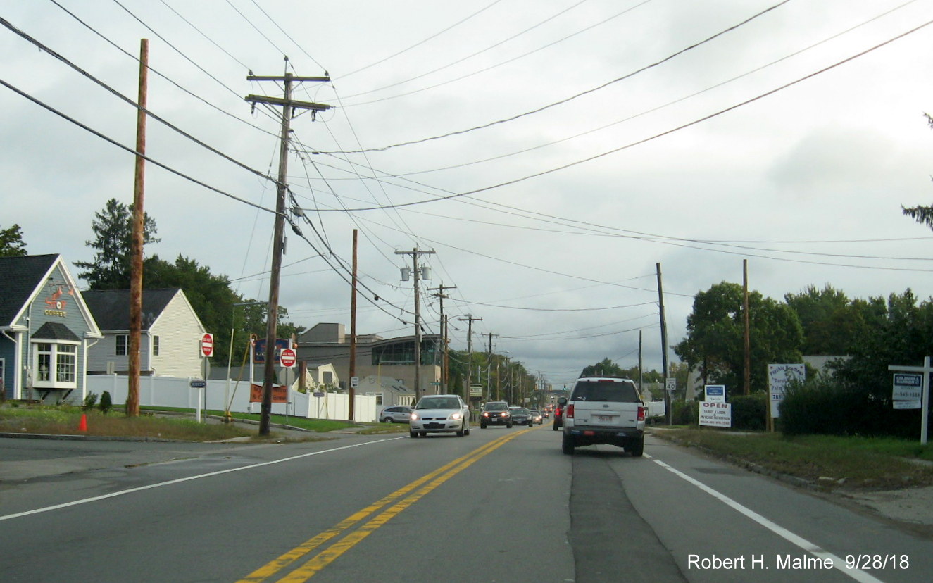 Image of new utility poles being placed outside of future lanes of widened MA 18 in Weymouth
