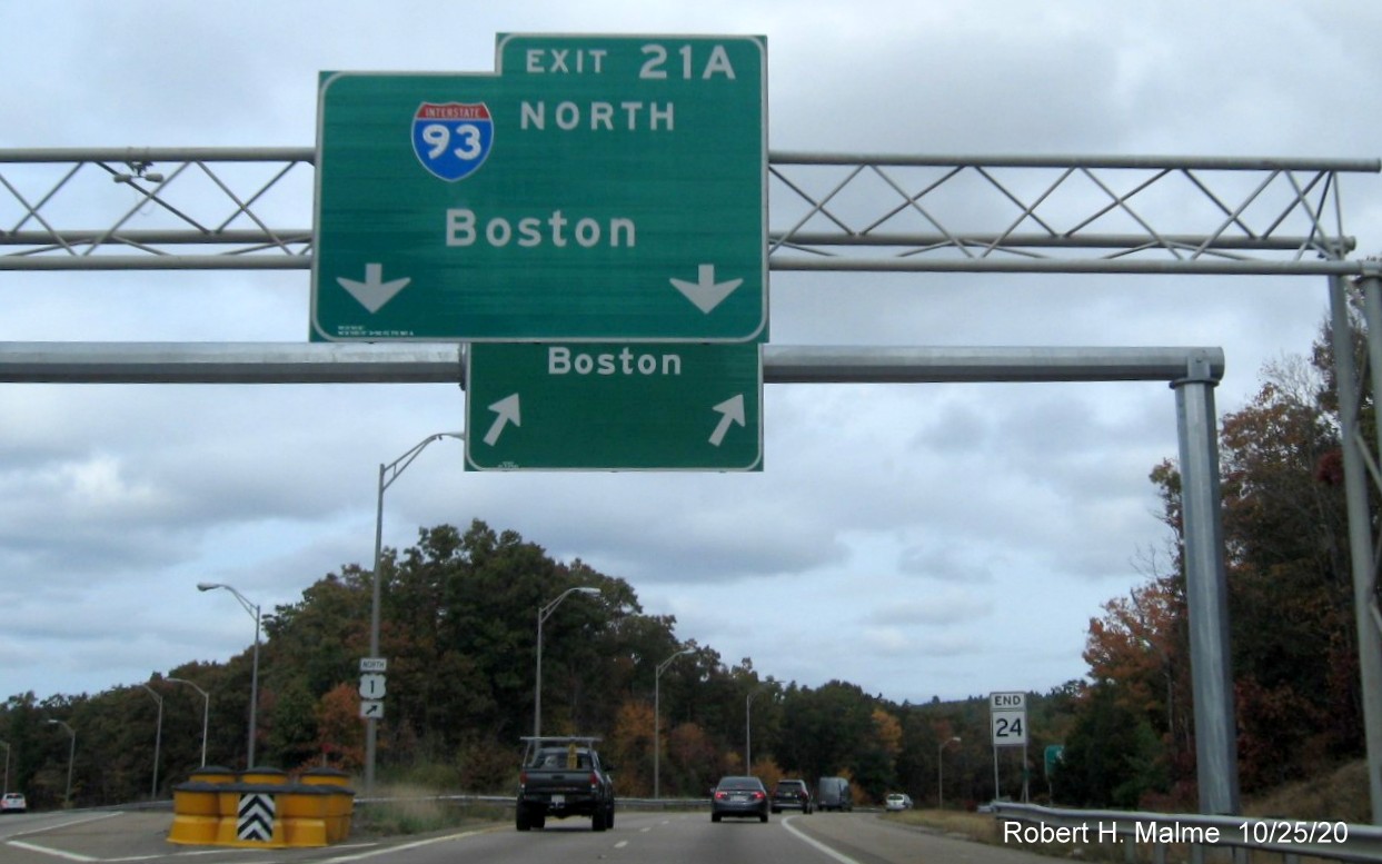 Image of new overhead gantry with I-93 North ramp sign behind existing sign at end of MA 24 North in Randolph, October 2020