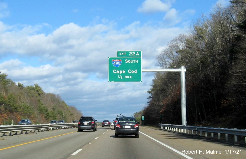 Image of 1/2 mile advance overhead sign for I-495 South exit with new milepost based exit number on MA 24 North in Raynham, January 2021