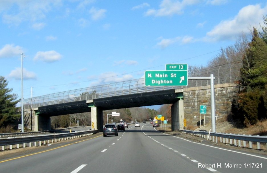 Image of overhead ramp sign for North Main Street exit with new milepost based exit number and gore sign with new number and yellow Old Exit 10 sign below on MA 24 North in Berkley, January 2021