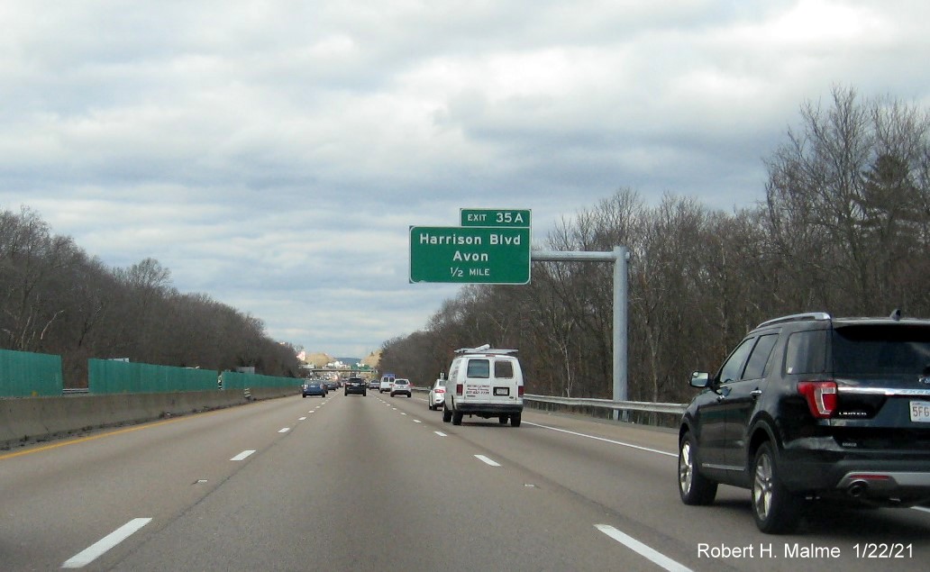 Image of 1/2 mile advance overhead sign for Harrison Blvd. exit with new milepost based exit number on MA 24 North in Avon, January 2021