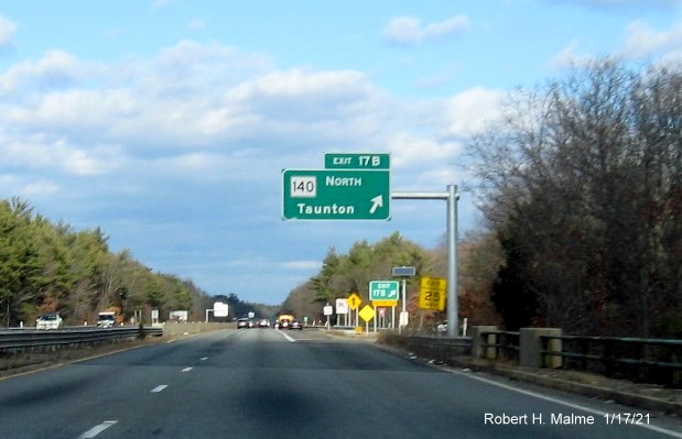 Image of overhead rampsign for MA 140 North exit with new milepost based exit numbers and yellow Old Exits 12 A sign below on MA 24 North in Taunton, January 2021