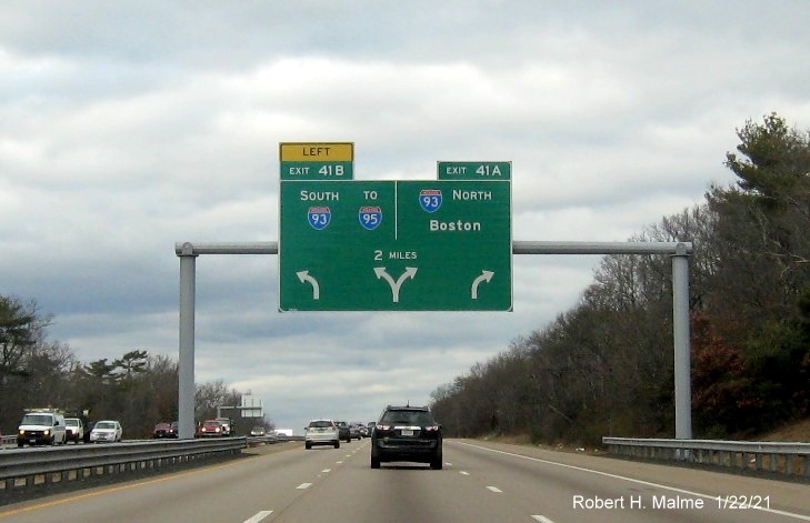 Image of 2-Miles advance overhead arrow-per-lane sign for I-93 exits with new milepost based exit numbers on MA 24 North in Randolph, January 2021