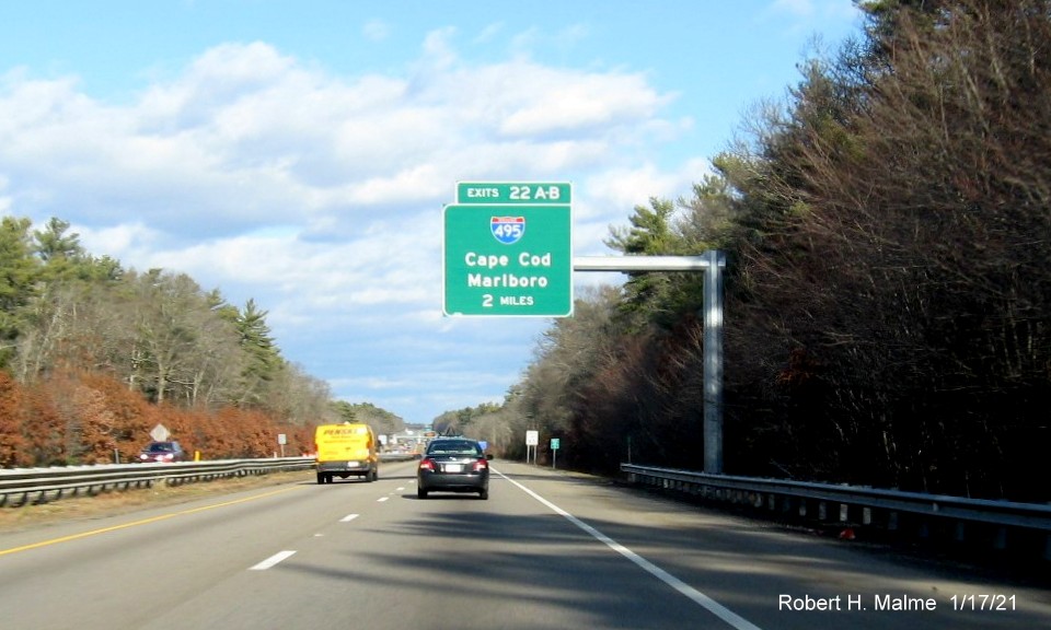 Image of 2-Miles advance overhead sign for I-495 exits with new milepost based exit numbers on MA 24 North in Raynham, January 2021