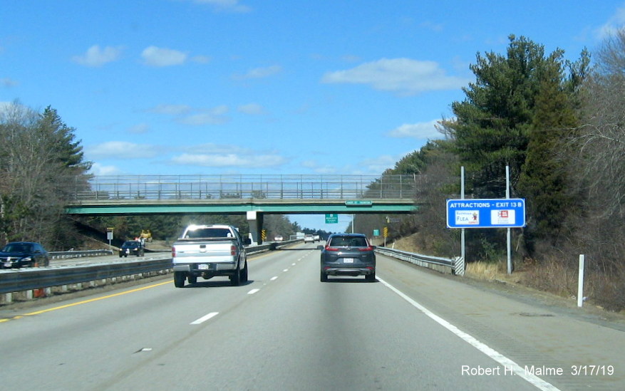 Image of partially installed blue service sign for US 44 exit on MA 24 North in Taunton