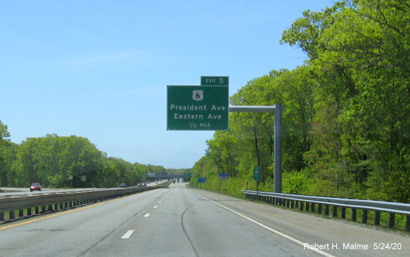 Image of recently placed 1/2 mile advance overhead sign for US 6 exit on MA 24 South in Fall River