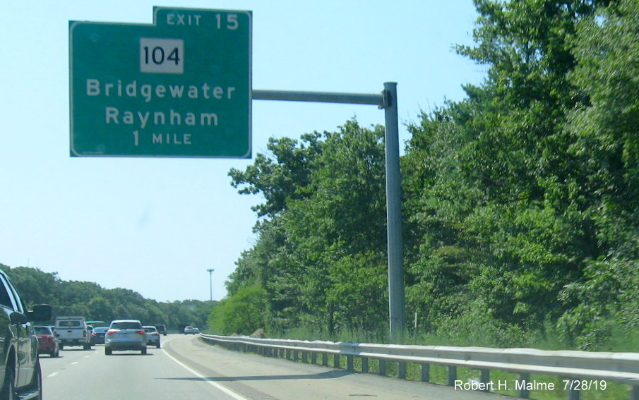 Image of new sign foundation placed behind existing overhead ramp sign for MA 104 exit on MA 24 South in Bridgewater
