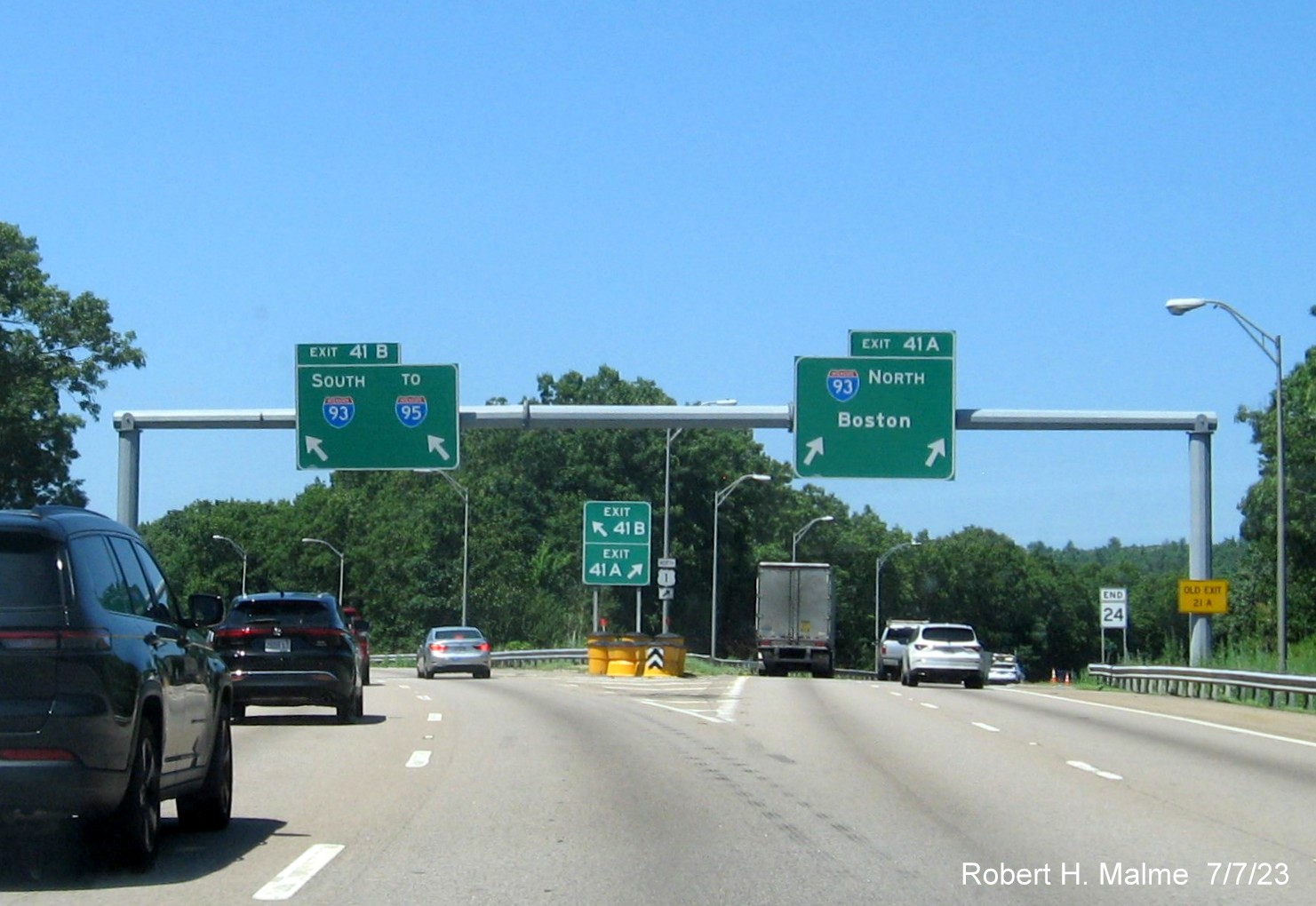 Image of overhead ramp sign for I-93 South exit with removed yellow Left Exit tab on MA 24 North in Randolph, July 2023