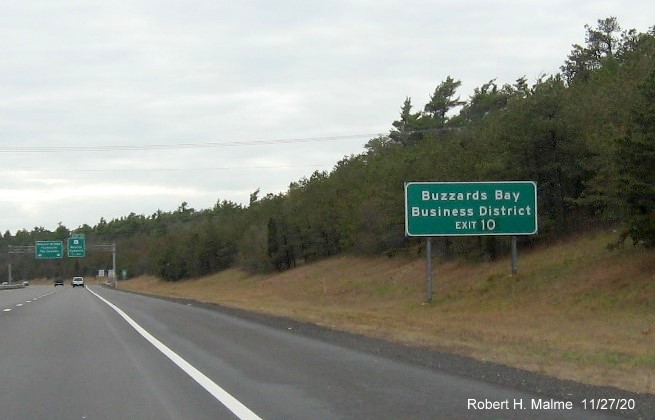 Image of ground mounted auxiliary sign for US 6 exit with new milepost based exit number on MA 25 East in Bourne, November 2020