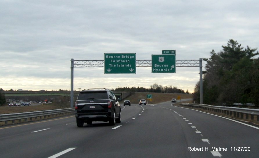 Image of overhead signs at ramp to US 6 exit with new milepost based exit number on MA 25 East in Bourne, November 2020