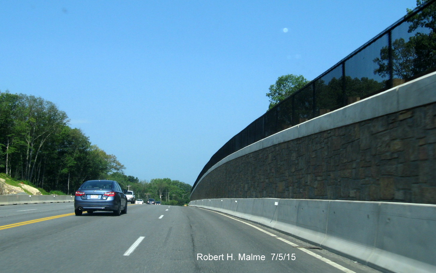 Image of new stone retaining wall along Route 2 westbound in Concord