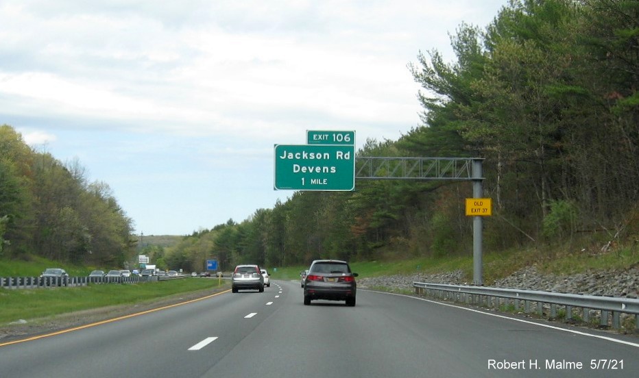 Image of 1 mile advance sign for Jackson Road exit with new milepost based exit number and yellow Old Exit 37 advisory sign on support on MA 2 East in Ayer, May 2021