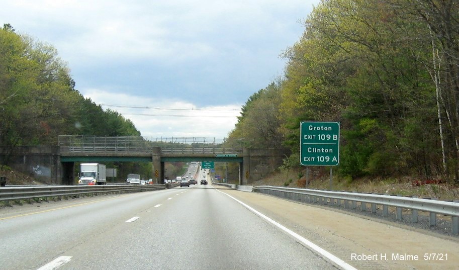 Image of auxiliary sign for MA 110/111 exits with new milepost based exit numbers on MA 2 West in Harvard, May 2021