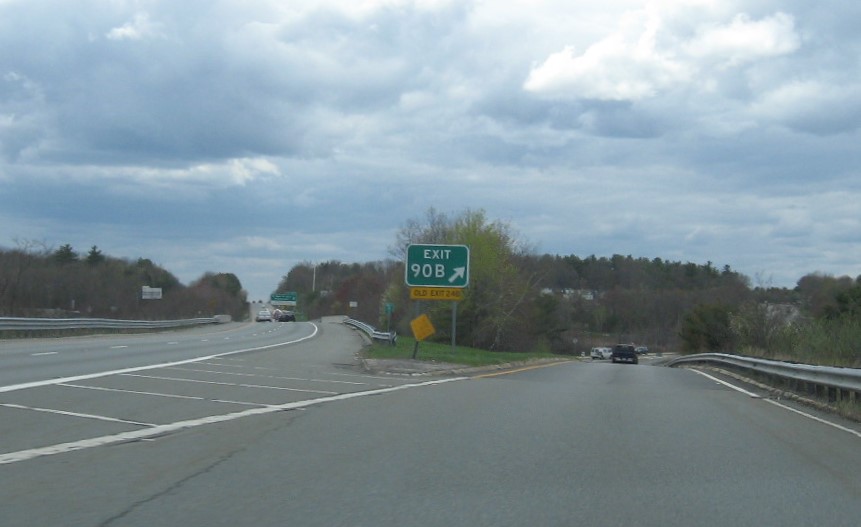 Image of gore sign for MA 140 North exit with new milepost based exit number and yellow Old Exits 24 B sign attached below on MA 2 West in Westminster, May 2021