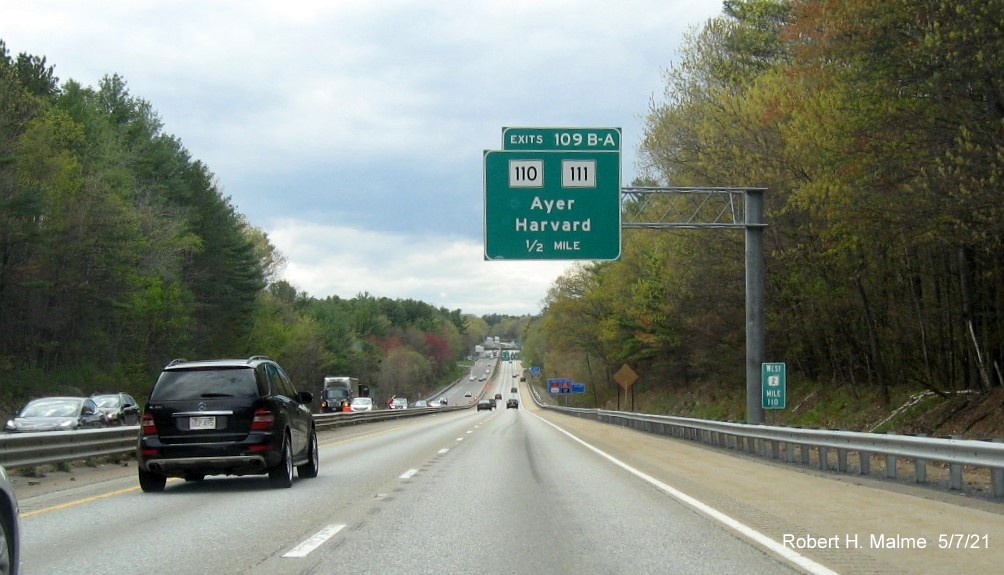 Image of 1/2 Mile advance overhead sign for MA 110/111 exits with new milepost based exit numbers on MA 2 West in Harvard, May 2021