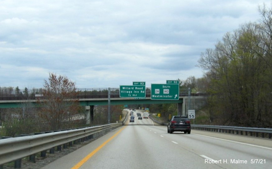 Image of overhead signage at ramp for MA 2A/South MA 140 exit with new milepost based exit numbers on MA 2 East in Westminster, May 2021