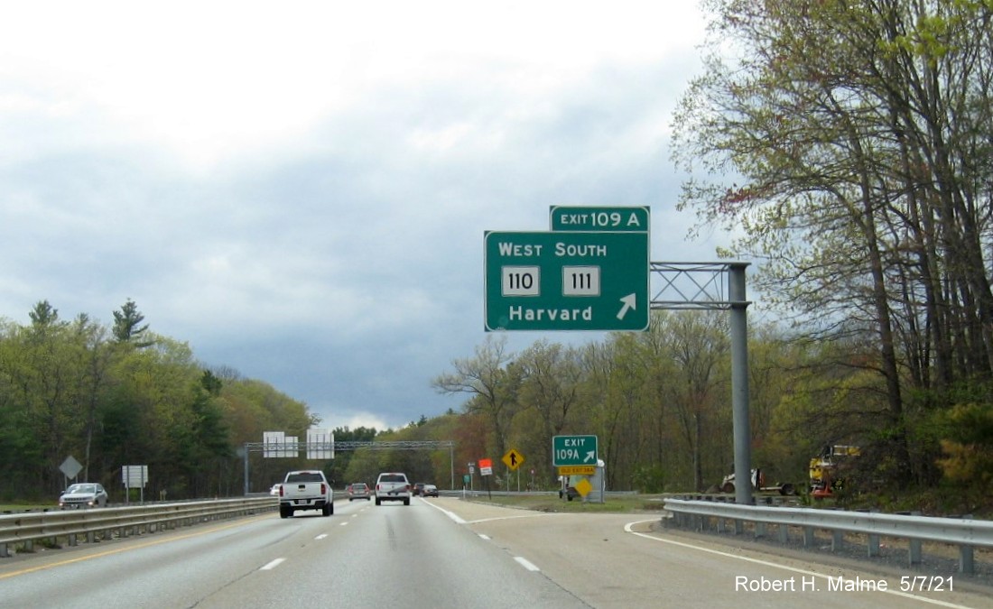 Image of overhead ramp sign for MA 110 West/111 South exit with new milepost based exit numbers on MA 2 West in Harvard, May 2021