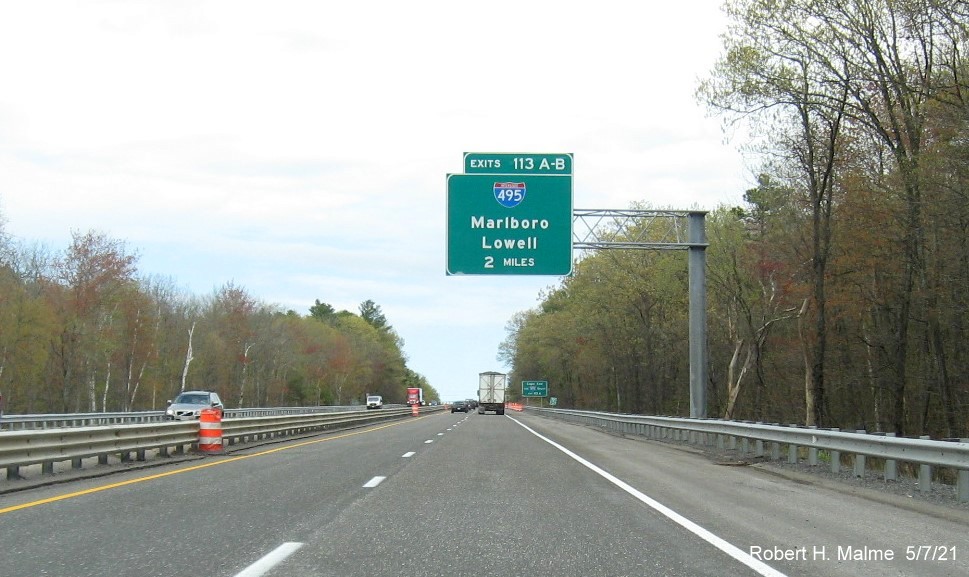 Image of 2 Miles advance overhead sign for I-495 exits with new milepost based exit numbers on MA 2 East in Littleton, May 2021