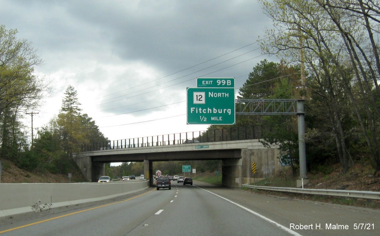 Image of 1/2 mile advance overhead sign for MA 12 North exit with new milepost based exit number on MA 2 West in Leominster, May 2021