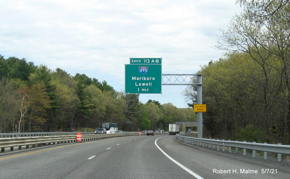 Image of 1 Mile advance overhead sign for I-495 exits with new milepost based exit numbers and yellow Old Exits 40 B-A advisory sign on support on MA 2 East in Littleton, May 2021