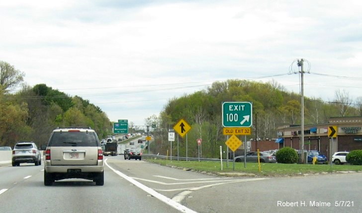 Image of gore sign for MA 13 exit with new milepost based exit number and yellow Old Exit 32 advisory sign attached below on MA 2 East in Leominster, May 2021