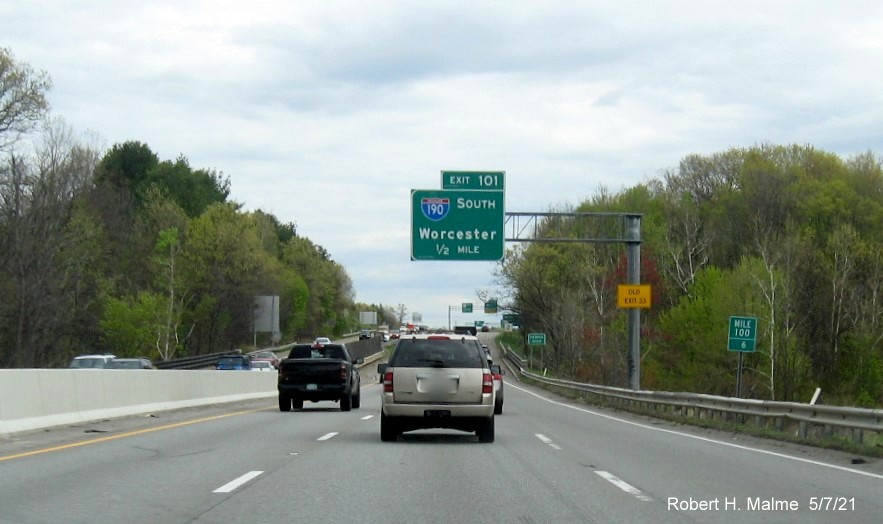 Image of 1/2 mile advance sign for I-190 South exit with new milepost based exit number and yellow Old Exit 33 advisory sign on support on MA 2 East in Leominster, May 2021