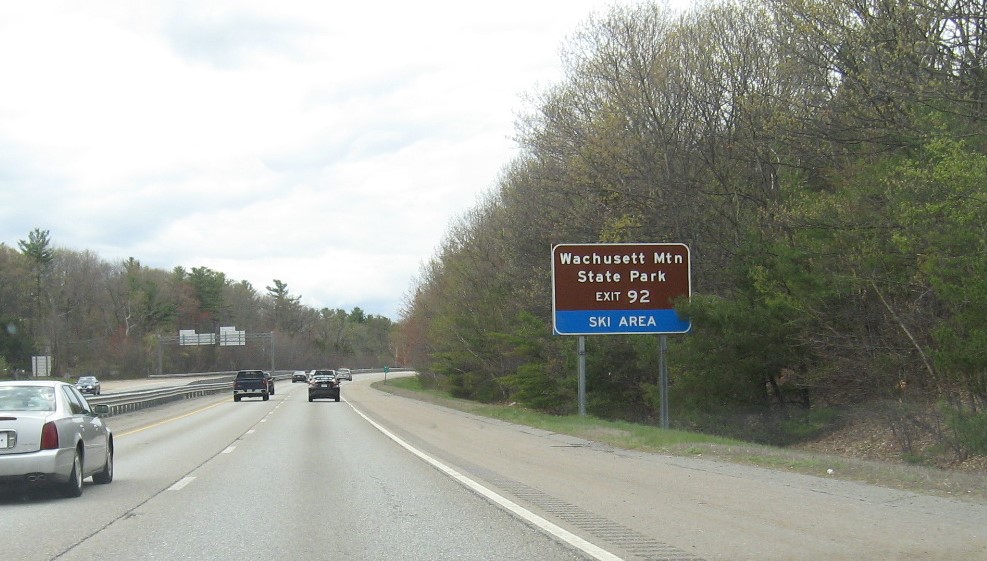 Image of auxiliary sign for MA 2A/South MA 140 exit with new milepost based exit number on MA 2 West in Westminster, May 2021