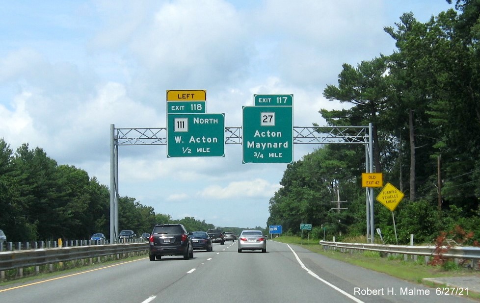 Image of 1/2 and 3/4 Mile advance overhead signs for MA 111 North and MA 27 exits with new milepost based exit numbers and yellow Old Exit 42 advisory sign on right support on MA 2 West in Acton, June 2021