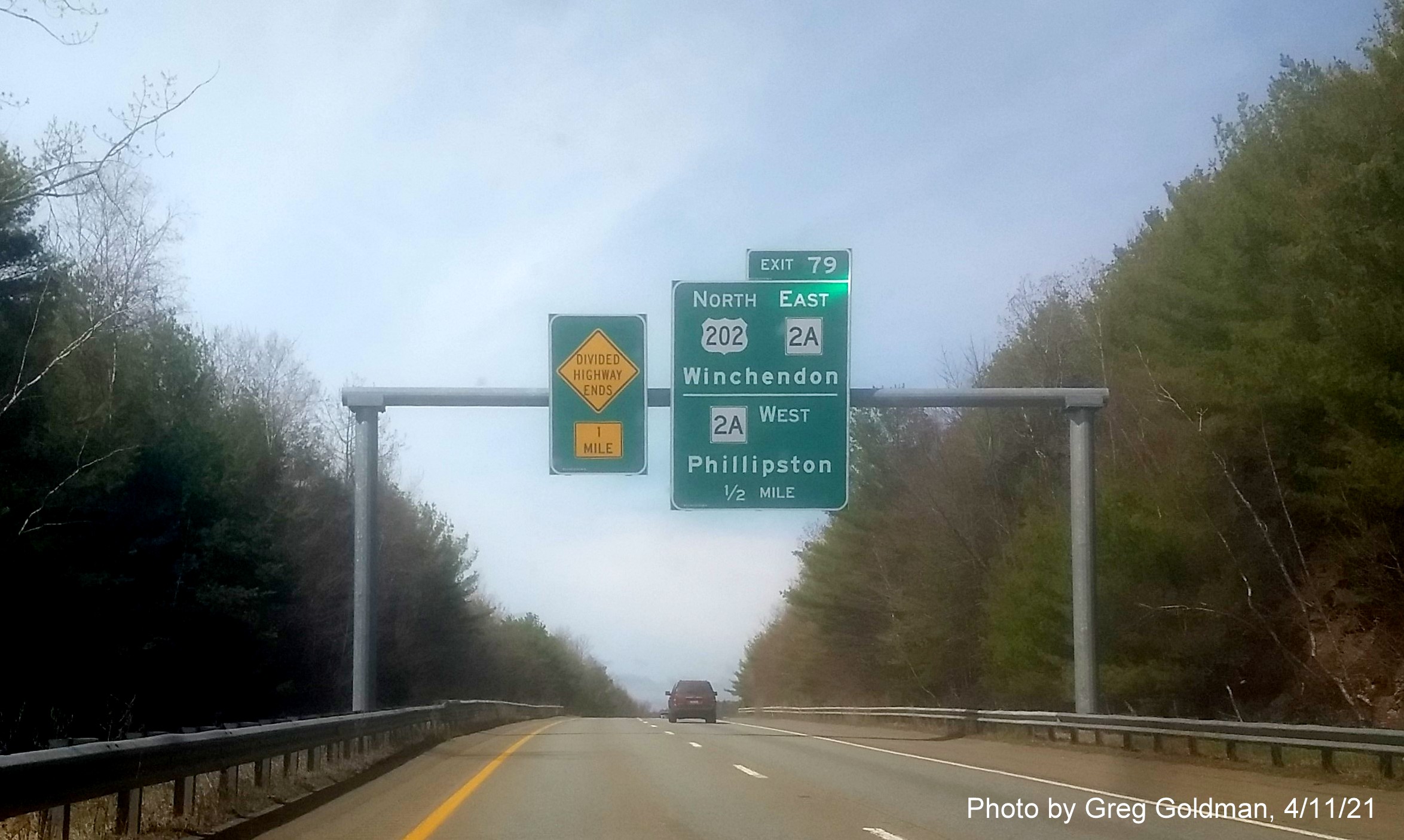 Image of 1/2 Mile advance overhead sign for US 202 North/MA 2A exit with new milepost based exit number on MA 2 West in Winchendon, by Greg Goldman, April 2021