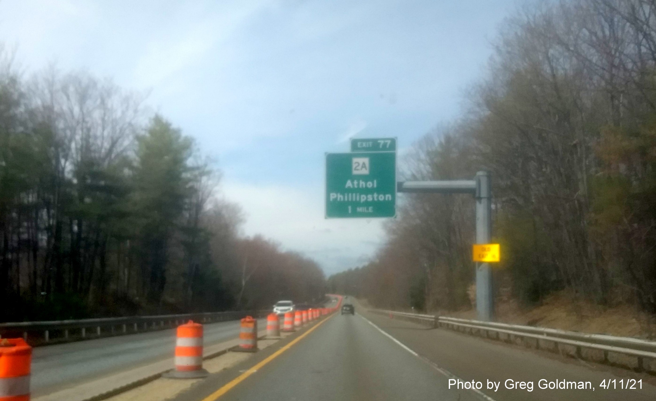 Image of 1 Mile advance sign for MA 2A exit with new milepost based exit number with yellow Old Exit 18 advisory sign on support on MA 2 West in Athol, by Greg Goldman, April 2021
