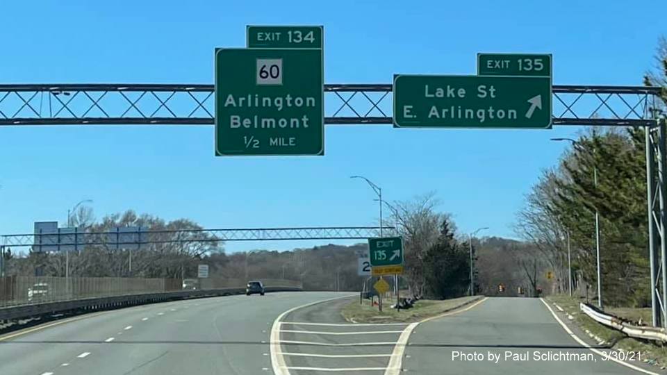 Image of overhead signs at ramp for Lake Street exit with new milepost based exit numbers on MA 2 West in Arlington, by Paul Schlichtman, March 2021