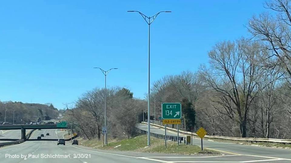 Image of gore sign for MA 60 exit with new milepost based exit number and yellow Old Exit 59 advisory signs below on MA 2 West in Arlington, by Paul Schlichtman, March 2021