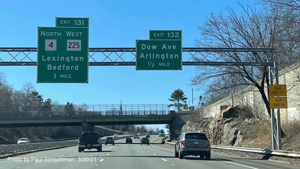 Image of advance overhead signage for Dow Avenue and MA 4/MA 225 exits with new milepost based exit numbers on MA 2 West in Arlington, by Paul Schlichtman, March 2021